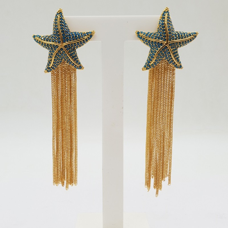 Vergulde oorbellen zeester met Turkoois blauwe crystals