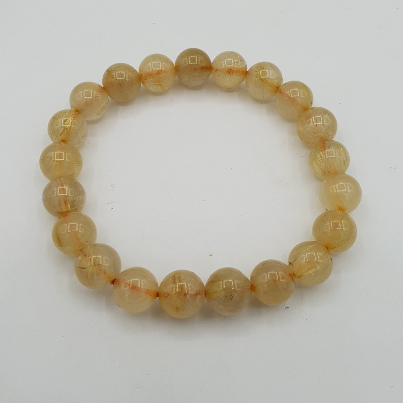 Stretch armband met gouden Rutielkwarts
