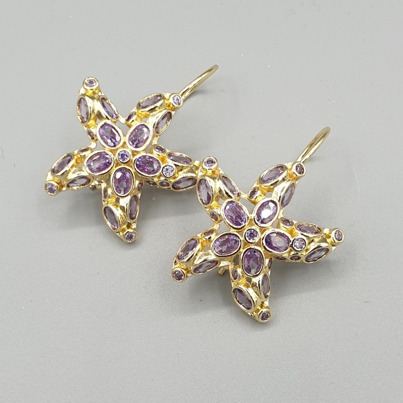 Vergulde oorbellen zeester paarse crystals