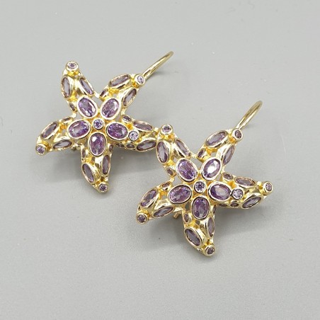 Vergulde oorbellen zeester paarse crystals