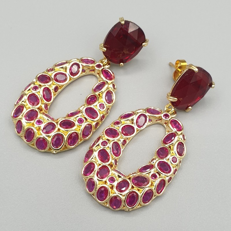 Vergulde oorbellen met rood crystal