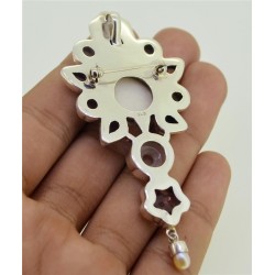 Zilveren hanger met gezicht, Ioliet, Topaas en Maansteen
