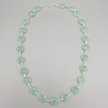 Zilveren ketting rond om gezet met ronde facet aqua Chalcedoon