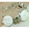 Zilveren armband met uit been gesneden gezichten