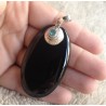 Zilveren hanger met grote ovale Onyx en blauw Topaas