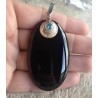 Zilveren hanger met grote ovale Onyx en blauw Topaas