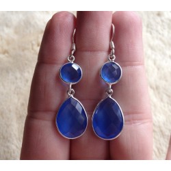 Zilveren oorbellen met ronde en druppelvorm blauw Topaas