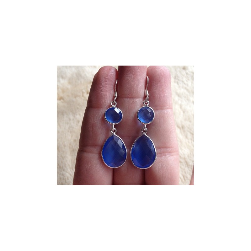 Zilveren oorbellen met ronde en druppelvorm blauw Topaas
