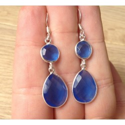Zilveren oorbellen met ronde en druppelvorm blauw Topaas