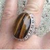 Zilveren ring met grote Tijgeroog in bewerkte setting maat 18.3
