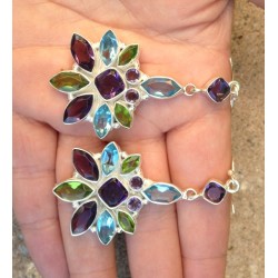 Zilveren oorbellen gezet met blauw Topaas, Amethist en Peridot