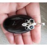 Zilveren hanger met grote zwarte Onyx gezet met Onyx en Topaas