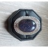 Zilveren ring gezet met Goudsteen en bewerkte kop maat 17 mm