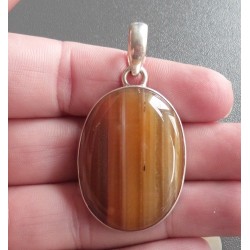 Zilveren hanger gezet met oranje / bruine Botswana Agaat