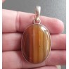 Zilveren hanger gezet met oranje / bruine Botswana Agaat