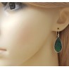 Zilveren oorbellen met uitgesneden Emerald