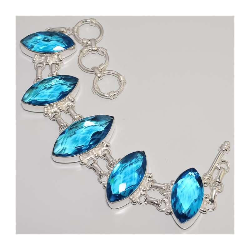 Zilveren edelsteen armband met 5 blauw Topaas stenen