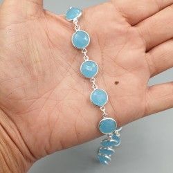 Zilveren ketting rond om gezet met ronde facet blauw Chalcedoon