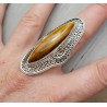 Zilveren ring gezet met marquise Tijgeroog en bewerkte kop 18.5