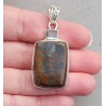 Zilveren hanger gezet met Boulder Opaal en blauw Topaas