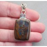 Zilveren hanger gezet met Boulder Opaal en blauw Topaas