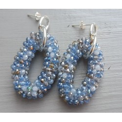 Zilveren oorbellen met ovale hanger van blauw / grijze kristalle