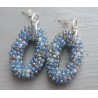 Zilveren oorbellen met ovale hanger van blauw / grijze kristalle