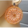 Zilveren oorbellen oranje ronde hanger van zijdedraad en kristallen