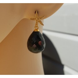Oorbellen met zeester en Emerald briolet