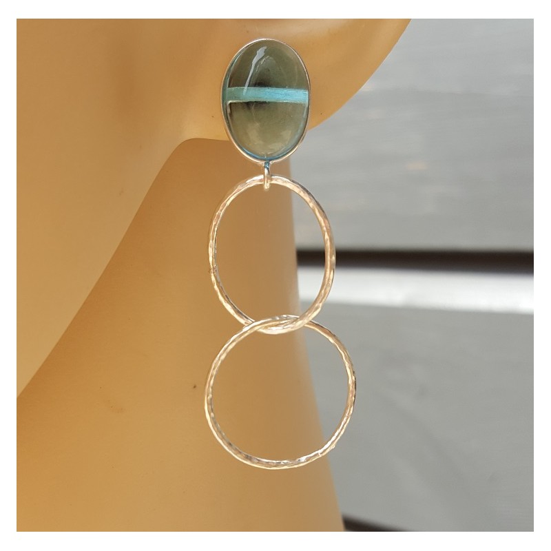 Zilveren oorbellen met blauw Topaas en zilveren ringen