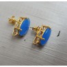 Vergulde oorknoppen gezet met blauw Chalcedoon