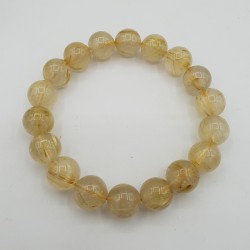 Stretch armband met gouden Rutielkwarts kralen