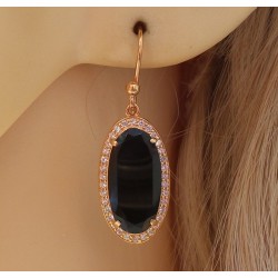 Vergulde oorbellen gezet met ovale facet Onyx en Zirkonia