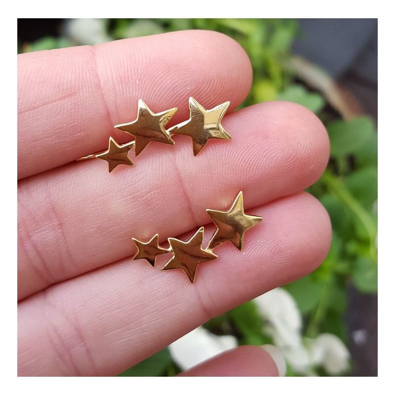 Vergulde earclimber met zilveren sterren