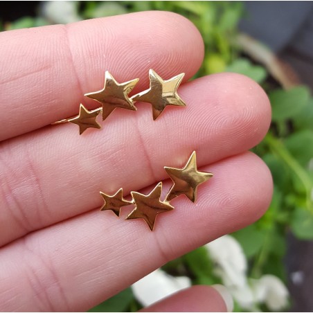 Vergulde earclimber met zilveren sterren