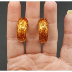Goudkleurige brede oranje glitter creolen