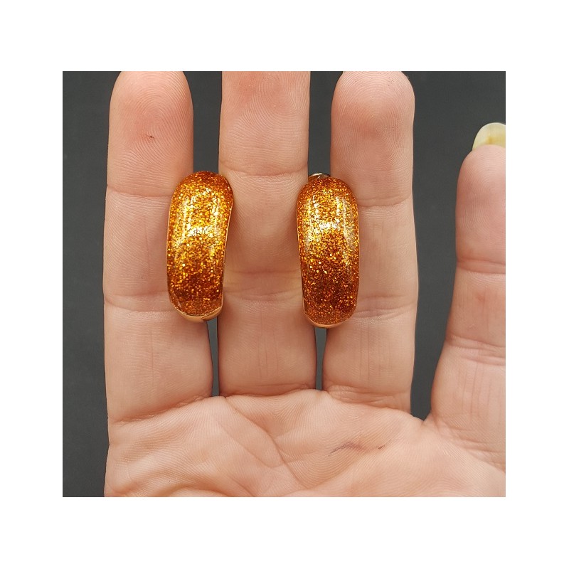 Goudkleurige brede oranje glitter creolen