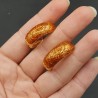 Goudkleurige brede oranje glitter creolen