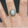 Zilveren ring gezet met cabochon ovale regenboog Maansteen