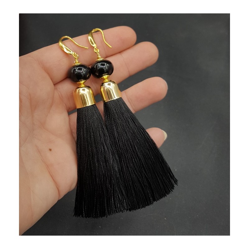 Vergulde oorbellen met zwarte tassel en Onyx