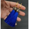 Vergulde blauwe tassel oorbellen met kristallen en parel