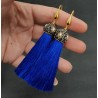 Vergulde blauwe tassel oorbellen met kristallen en parel