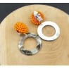 Oorbellen met oranje kristallen en schelp hanger