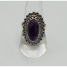 Zilveren ring met ovale cabochon Amethist en bewerkte kop 18