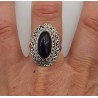 Zilveren ring met ovale cabochon Amethist en bewerkte kop 18