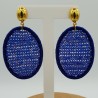 Oorbellen met ovale hanger van zijdedraad en blauwe kristallen