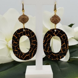 Vergulde oorbellen met gouden kristallen en resin
