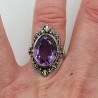 Zilveren ring met ovale facet Amethist en bewerkte kop 16.5 mm