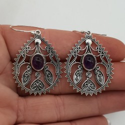 Zilveren oorbellen ovale cabochon Amethist bewerkte setting