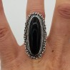 Zilveren ring gezet met zwarte Onyx en bewerkte kop